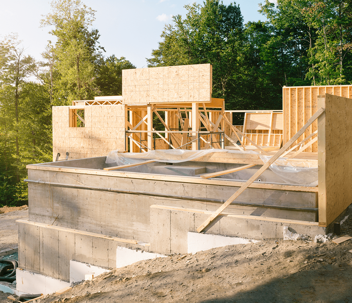 House under construction with wooden frames.