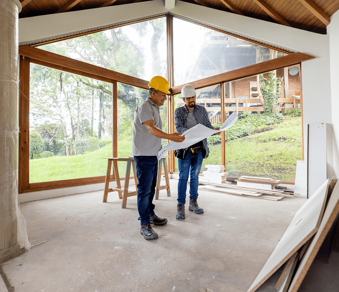 Two construction workers reviewing building plans.