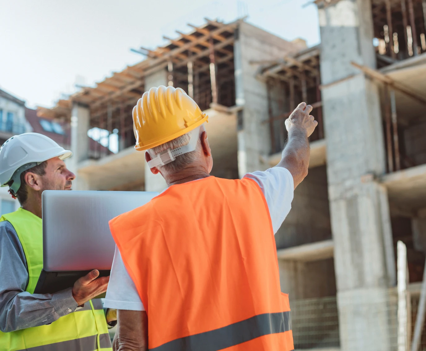 Construction workers inspecting building progress.